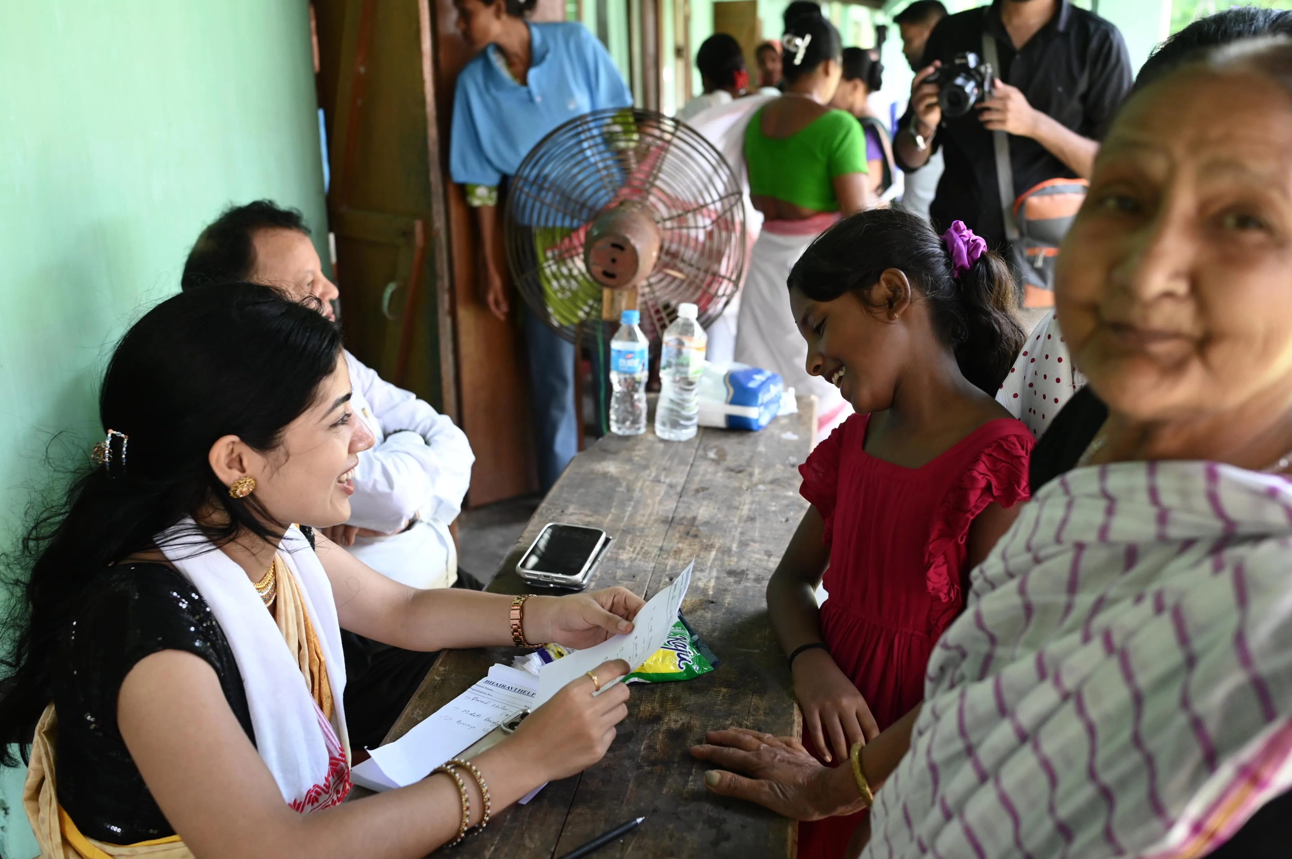 Health camp volunteers assisting patients