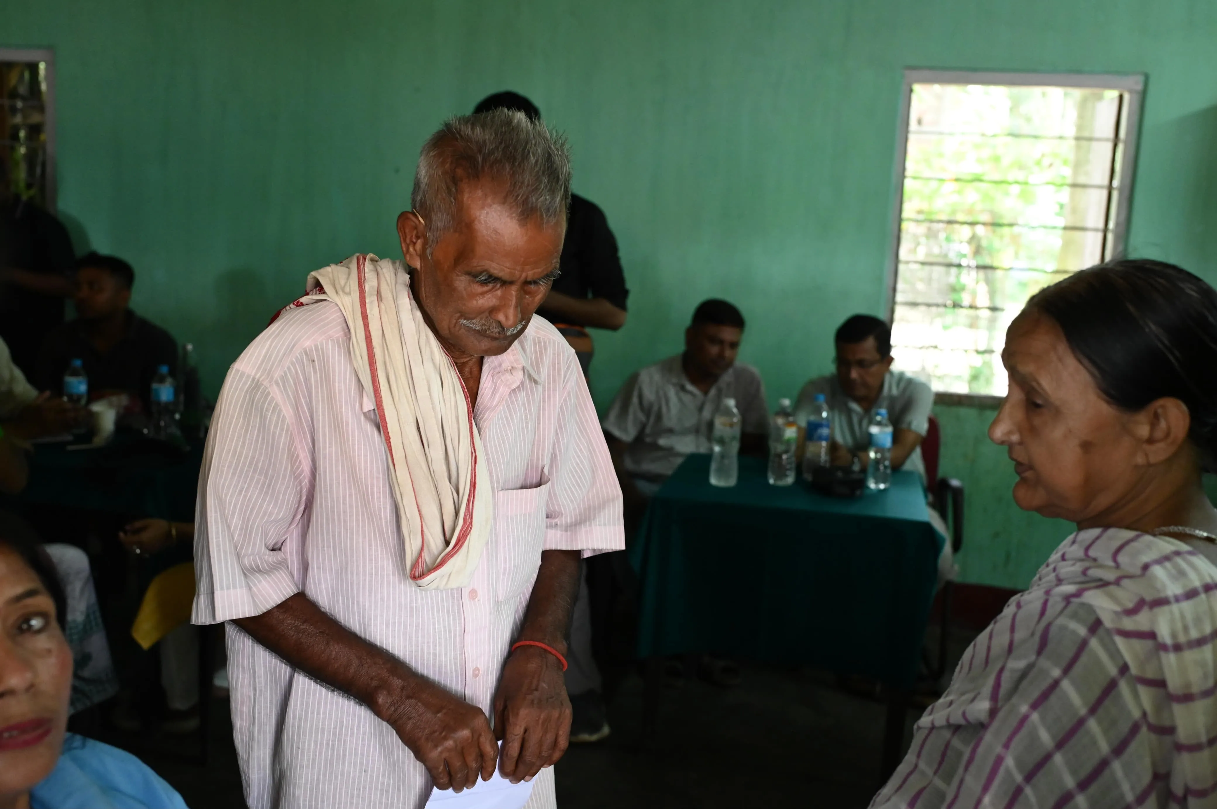 Medical practitioner giving prescription to local resident